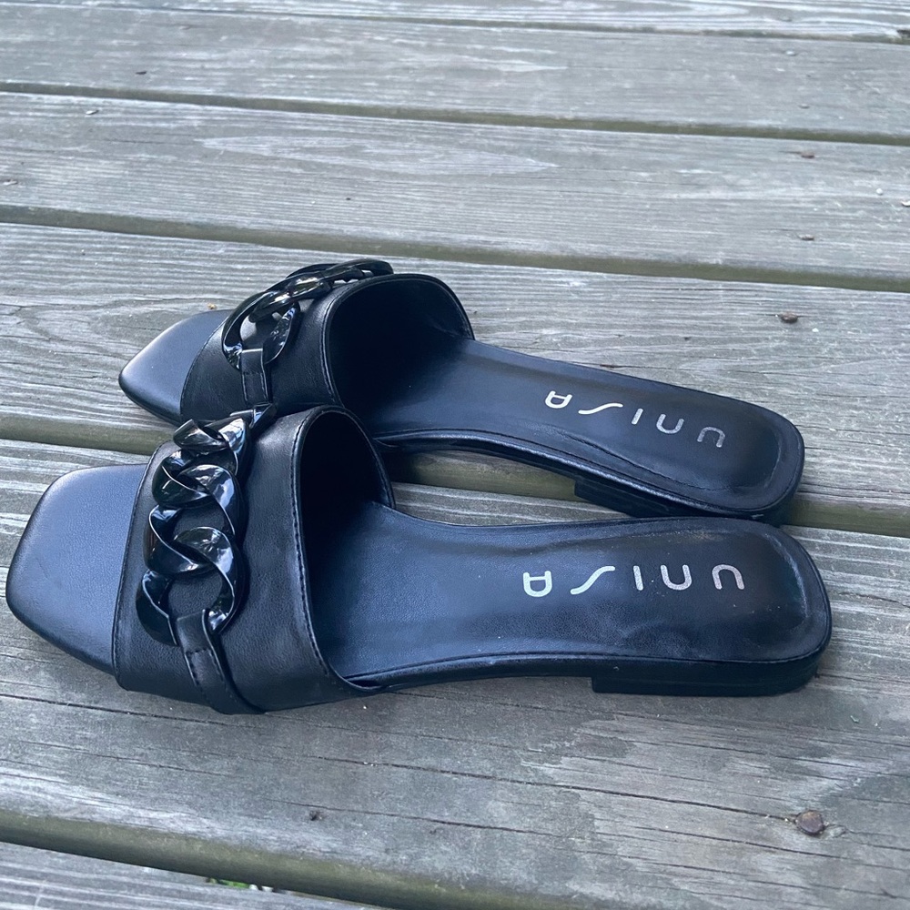 Black slide-on flats/sandals with crossing infinity design across strap!